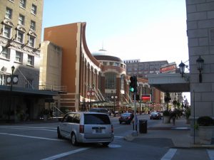 Downtown street view of St. Louis with a minivan turning a corner