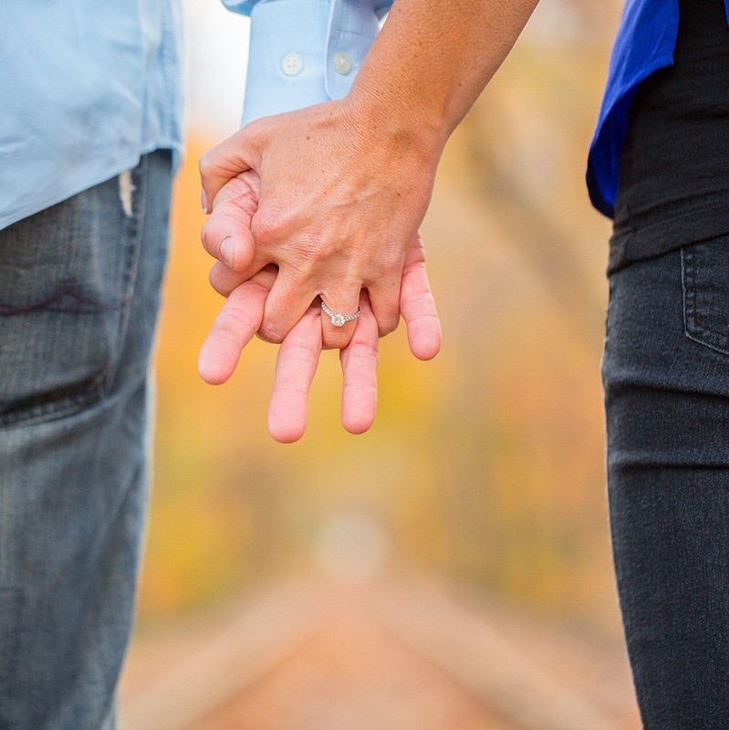 A couple holding hands.